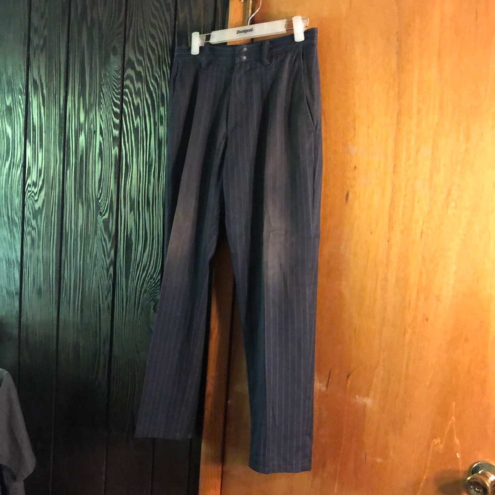 Navy blue with a gray pinstripe soft silky pants.  Slight fade around knee area